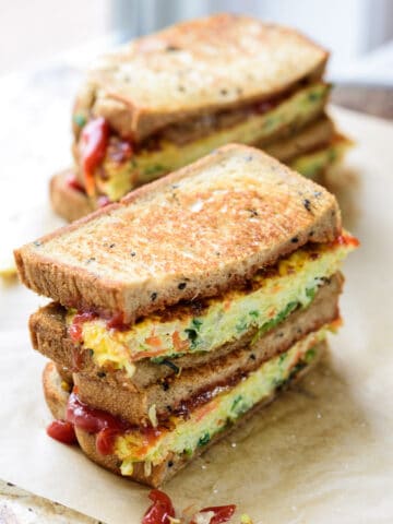 two Korean street egg toasts cut in halves and stacked up