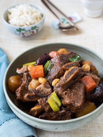 Korean braised beef short ribs served with a bowl of rice