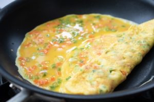 Rolling a thin sheet of eggs