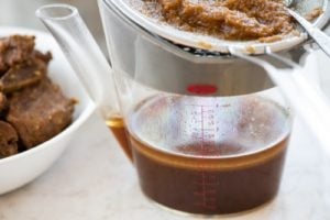 Straining the braising liquid