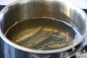 making anchovy broth in a pot