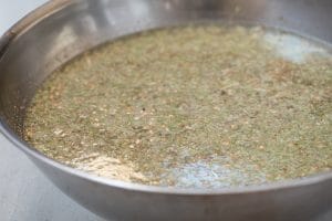 Soaking barley malt in water in a large bowl