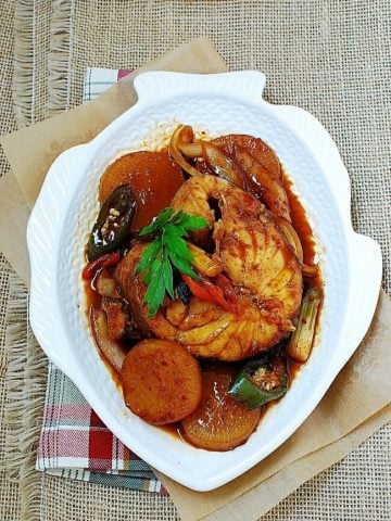 Daegu jorim (soy braised cod fish) in a fish shaped white plate