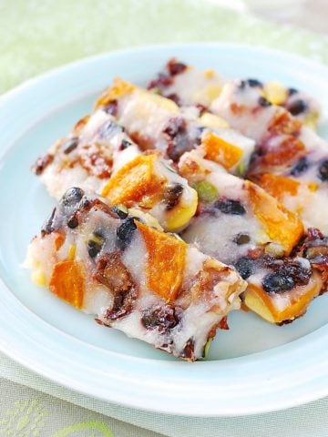 Youngyang chaltteok (Korean Sweet Rice Cake) with nuts and dried kabocha served in a plate