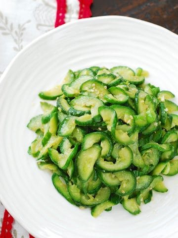 Stir-fried cucumber side dish in a white plate