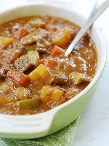 Korean curry rice with beef and vegetables in a casserole dish