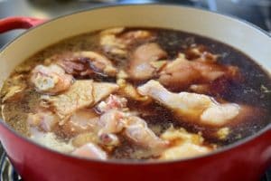 Chicken pieces in braising liquid